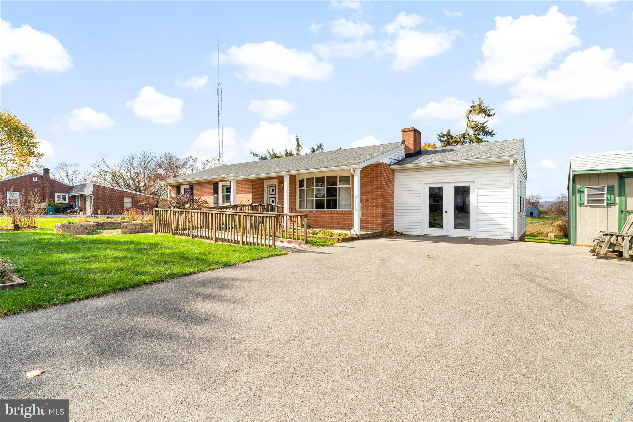 a view of a house with a backyard