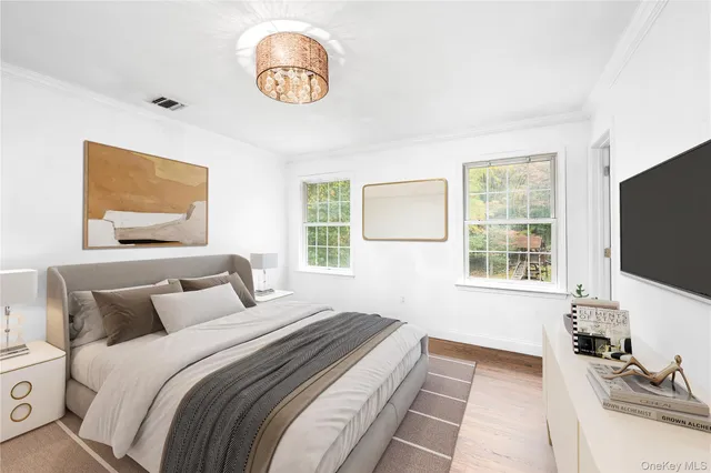 a bathroom with a granite countertop double vanity sink a mirror and a shower