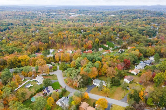 an aerial view of a house with swimming pool
