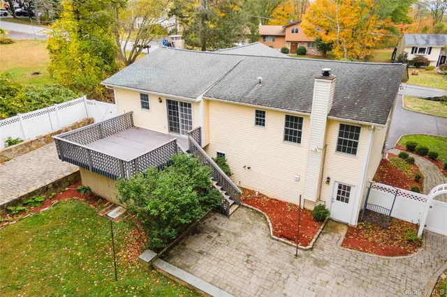 a view of a house with a yard and sitting area
