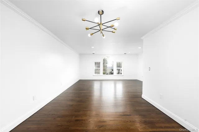 a view of a kitchen with hardwood floor and a ceiling fan