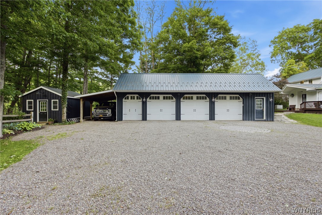 9788 Clarksburg Road Eden, NY 14057 - Photo 9 of 50 3.5 car garage with workshop and dog kennel