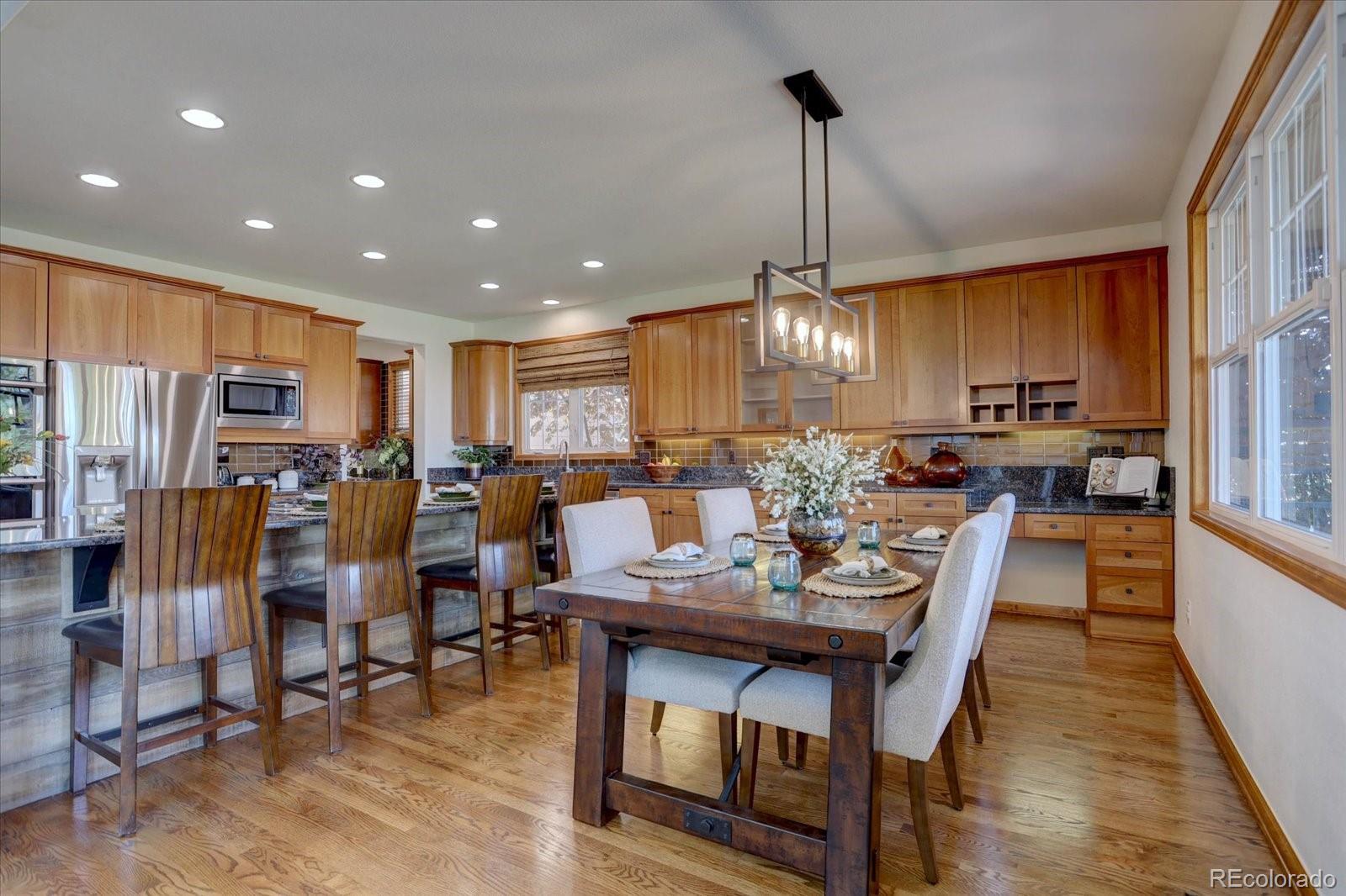 2795 Rockbridge Circle Highlands Ranch, CO 80129 - Photo 16 of 49 a view of a dining room with furniture window and wooden floor