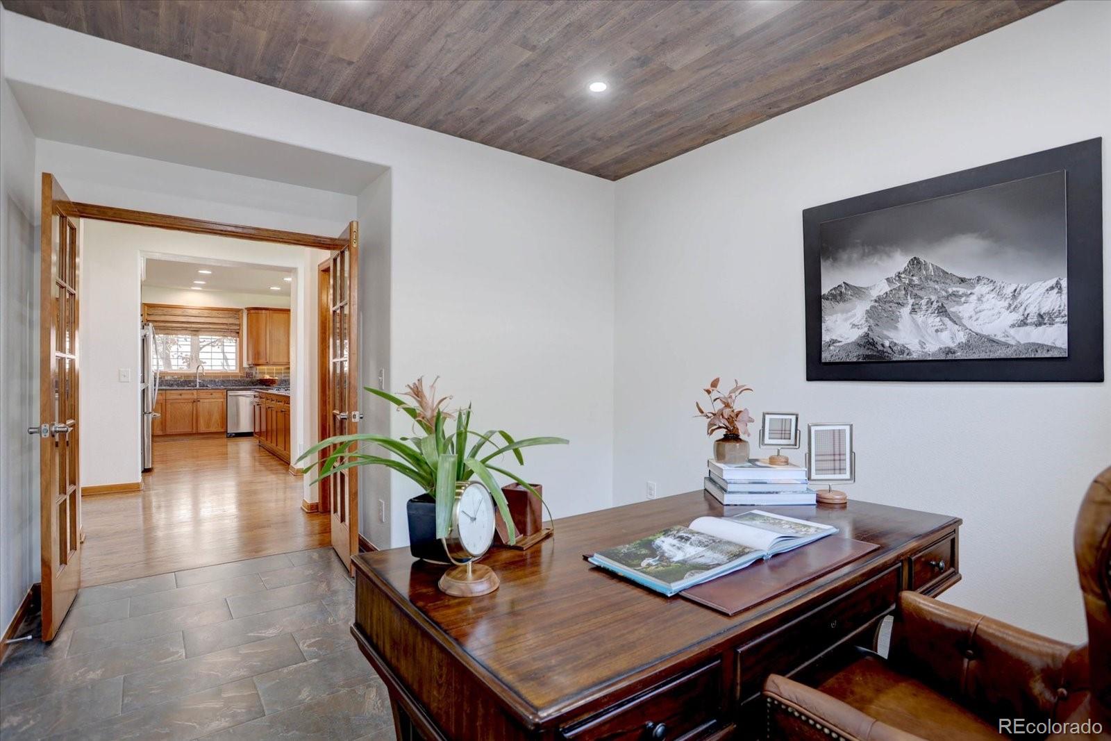 2795 Rockbridge Circle Highlands Ranch, CO 80129 - Photo 20 of 49 a living room with furniture and a potted plant