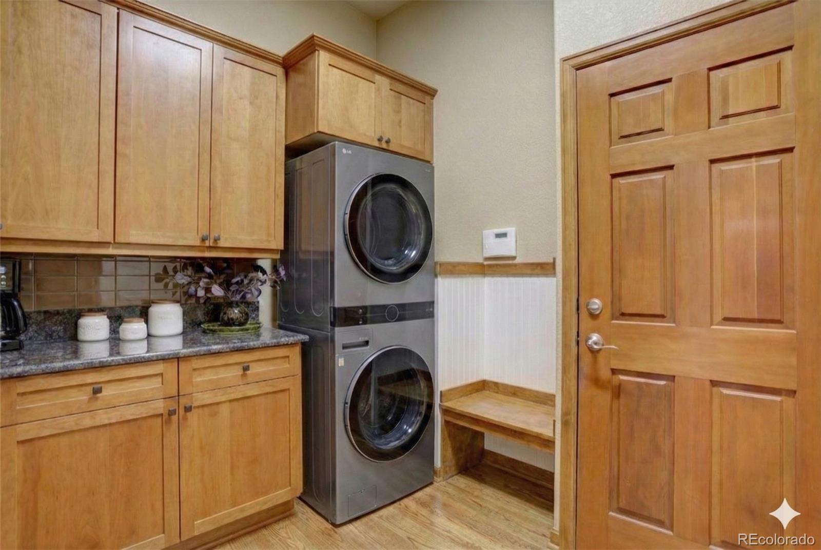 2795 Rockbridge Circle Highlands Ranch, CO 80129 - Photo 23 of 49 a utility room with sink dryer and washer