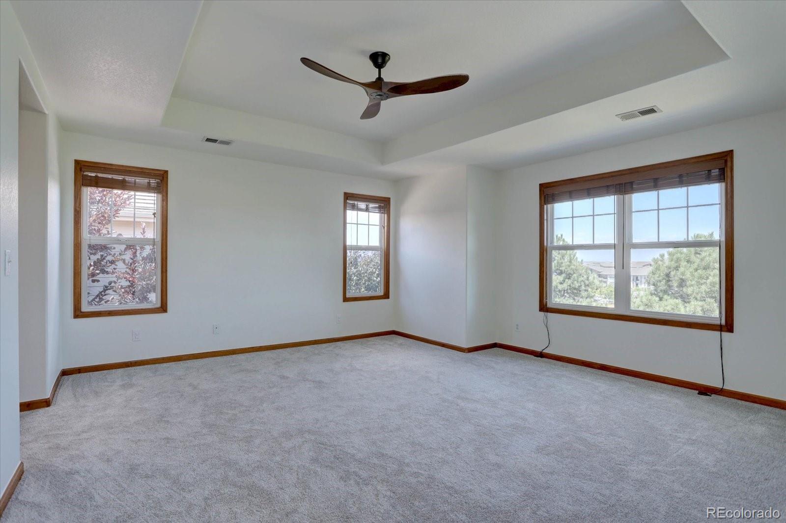 2795 Rockbridge Circle Highlands Ranch, CO 80129 - Photo 27 of 48 a view of a livingroom with a ceiling fan and window