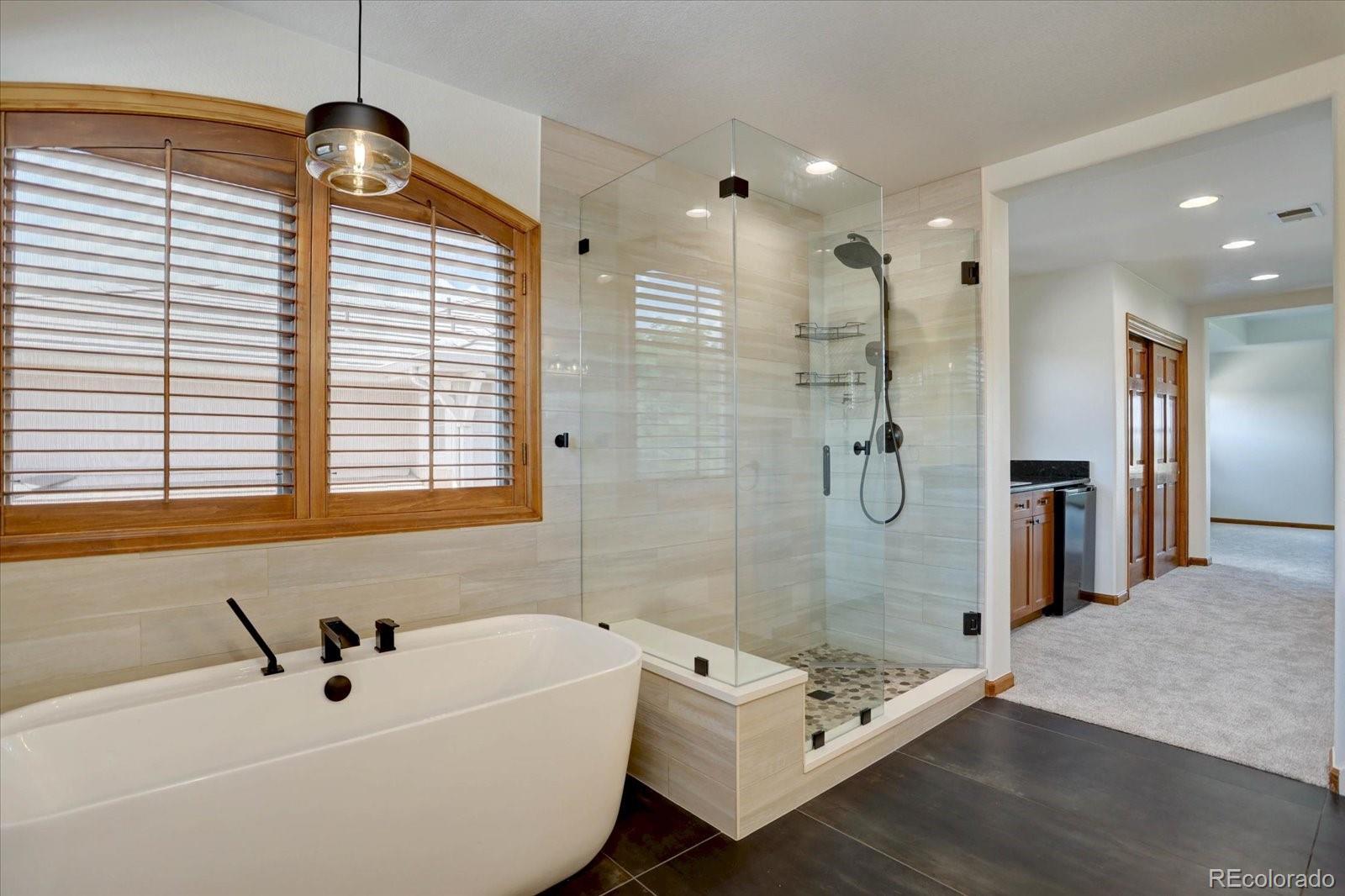 2795 Rockbridge Circle Highlands Ranch, CO 80129 - Photo 28 of 49 a bathroom with a bathtub and shower