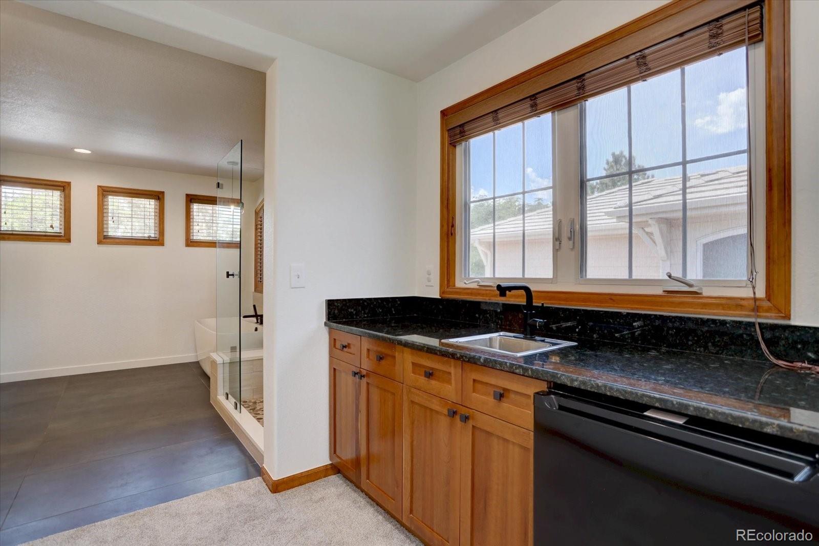 2795 Rockbridge Circle Highlands Ranch, CO 80129 - Photo 29 of 48 a bathroom with a sink and a window