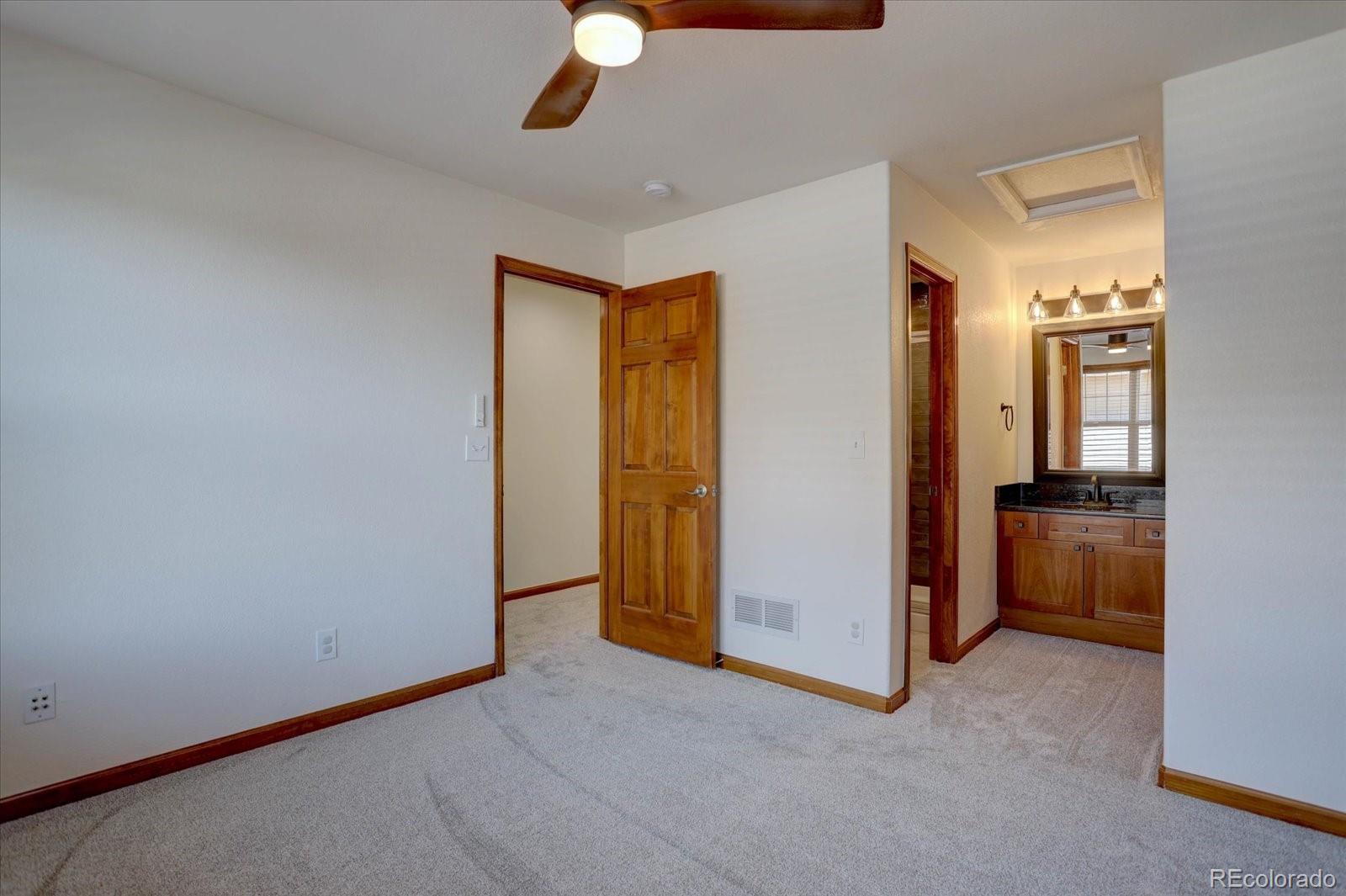 2795 Rockbridge Circle Highlands Ranch, CO 80129 - Photo 35 of 48 a view of empty room with a ceiling fan