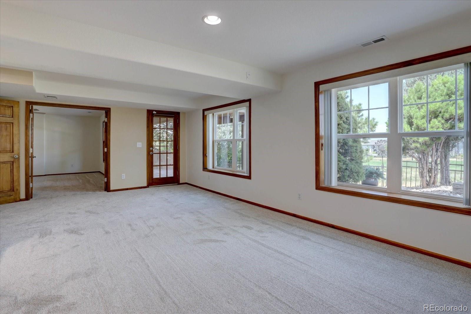 2795 Rockbridge Circle Highlands Ranch, CO 80129 - Photo 35 of 49 an empty room with windows and closet