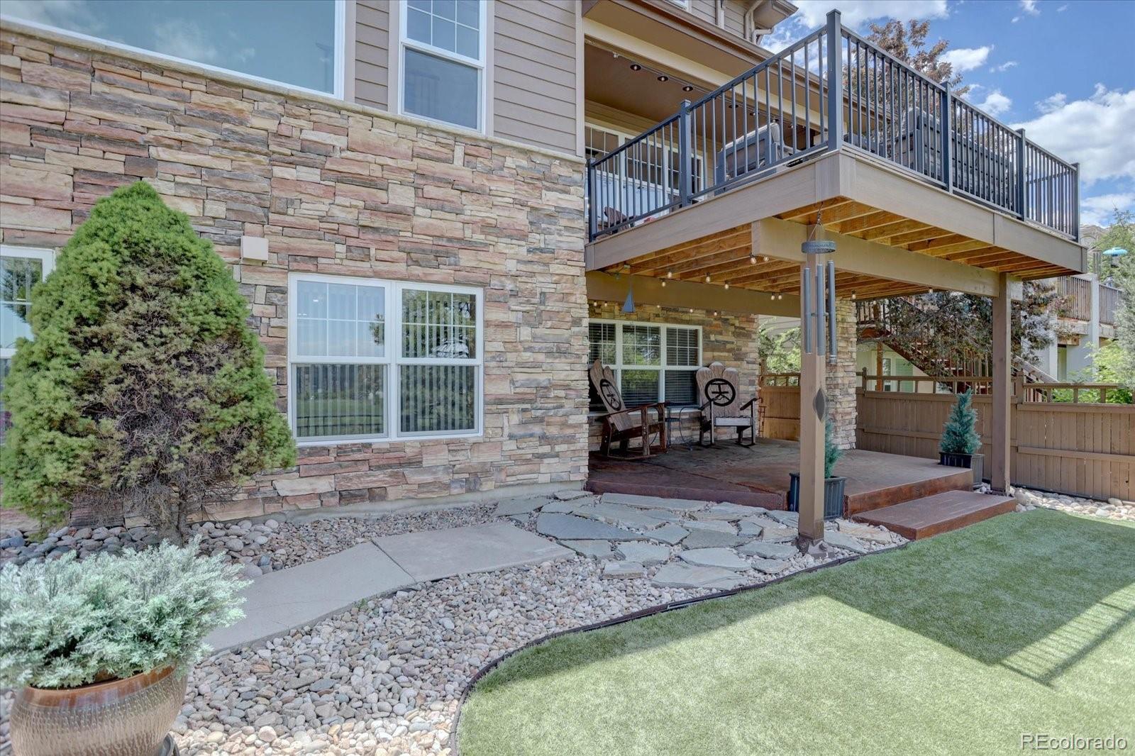 2795 Rockbridge Circle Highlands Ranch, CO 80129 - Photo 41 of 49 a view of a house with a porch and a patio