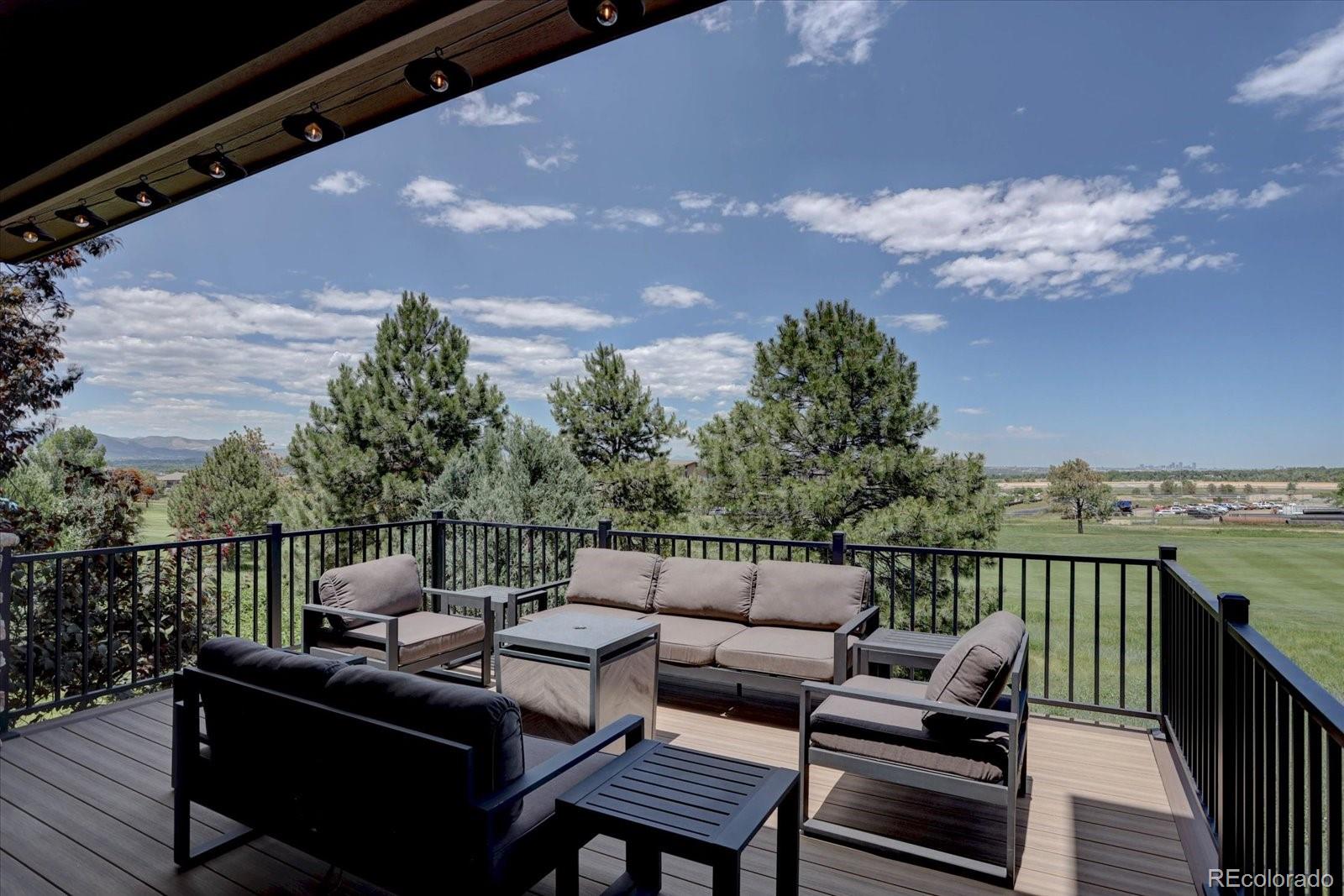 2795 Rockbridge Circle Highlands Ranch, CO 80129 - Photo 42 of 49 a roof deck with a potted plant and outdoor seating