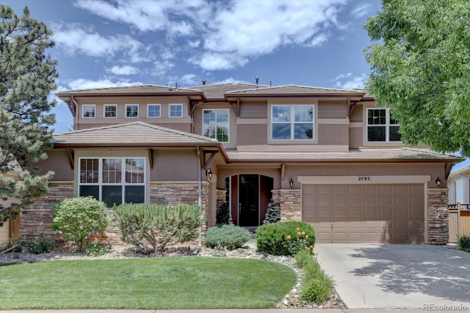 2795 Rockbridge Circle Highlands Ranch, CO 80129 - Photo 5 of 48 front view of house with a yard