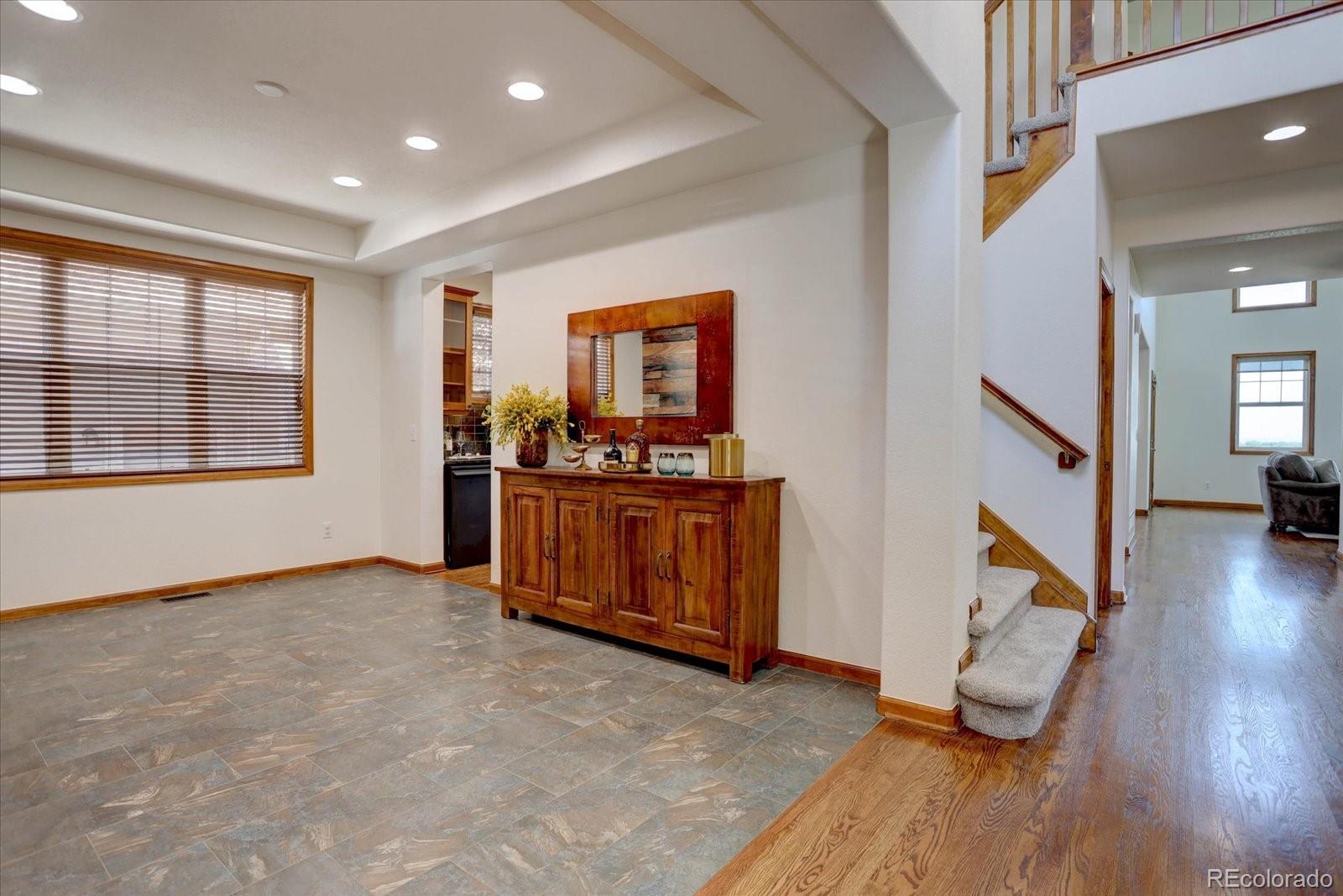 2795 Rockbridge Circle Highlands Ranch, CO 80129 - Photo 9 of 49 wooden floor in an empty room with a window and wooden floor