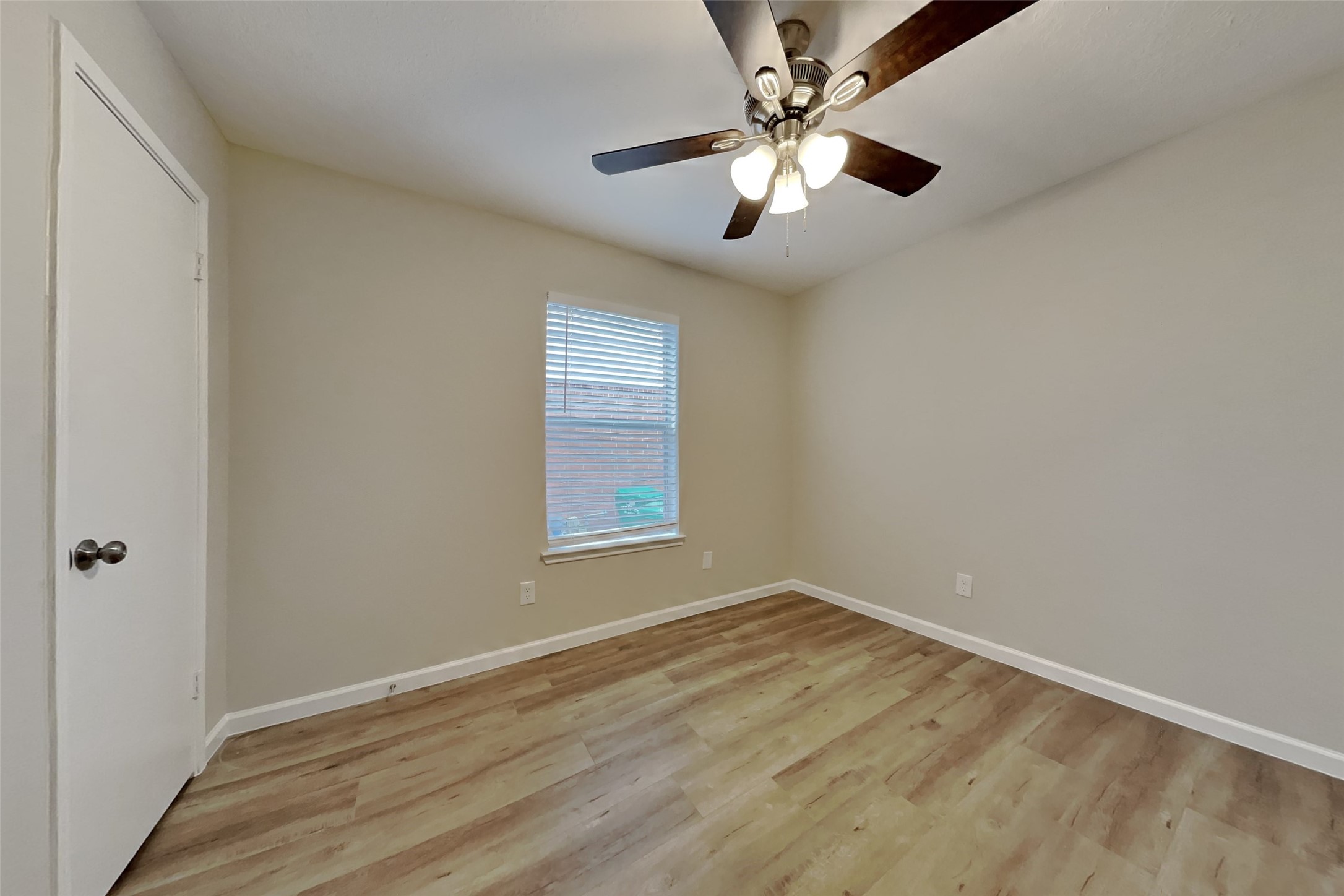 30806 Melita Drive Spring, TX 77386 - Photo 11 of 18 an empty room with wooden floor and windows