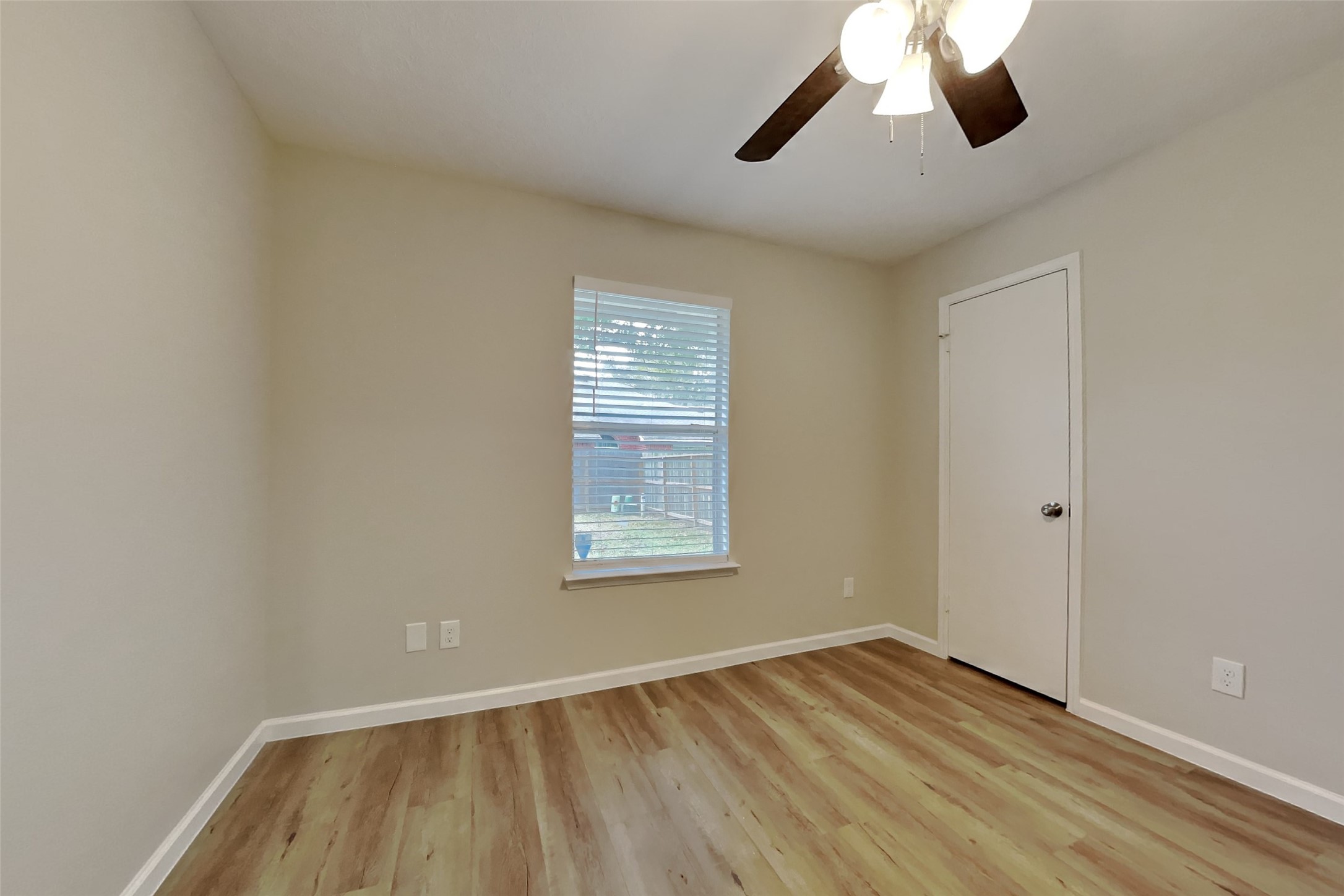 30806 Melita Drive Spring, TX 77386 - Photo 14 of 18 wooden floor in an empty room with a window