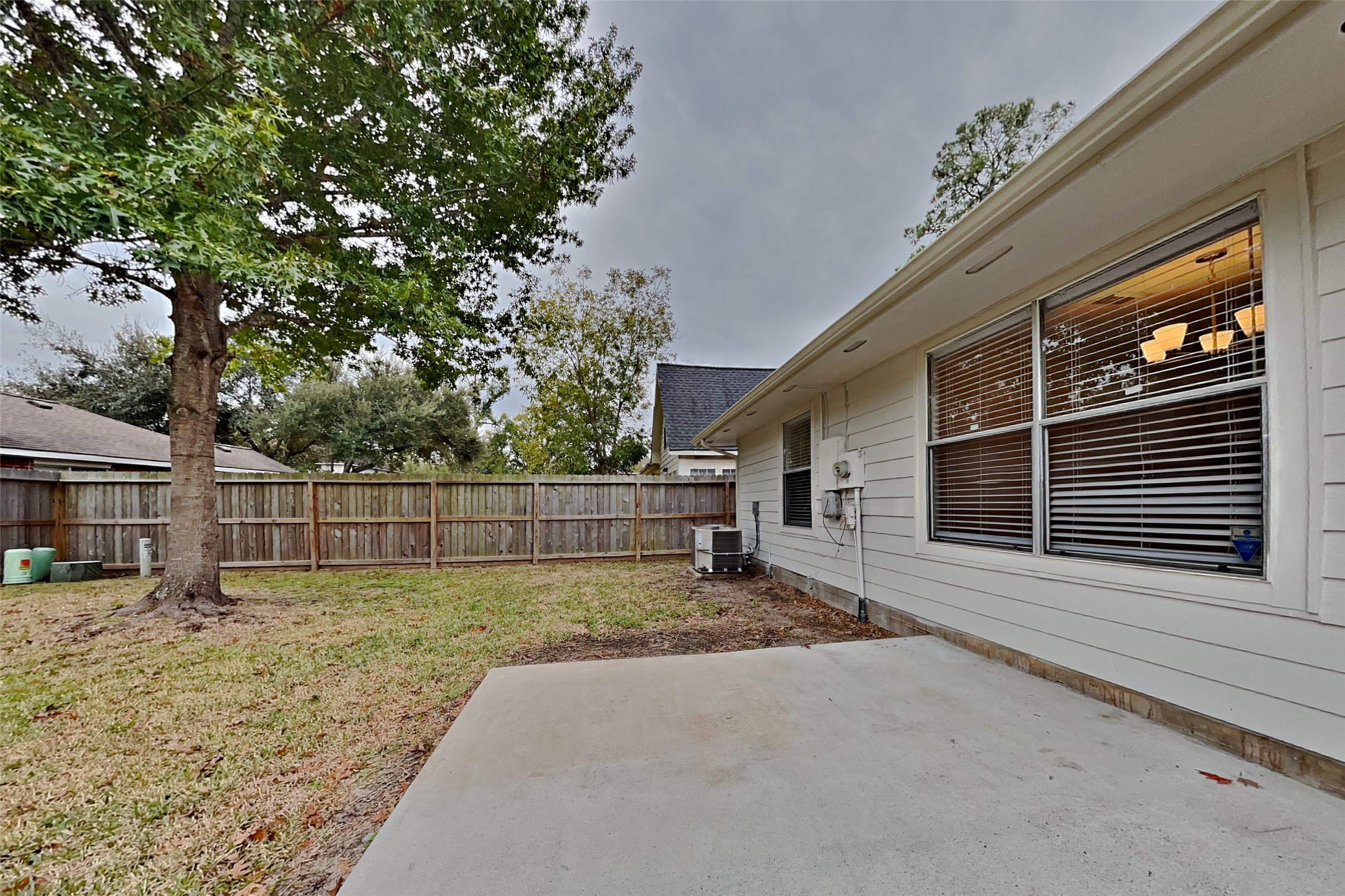 30806 Melita Drive Spring, TX 77386 - Photo 16 of 18 a view of a backyard with a tree