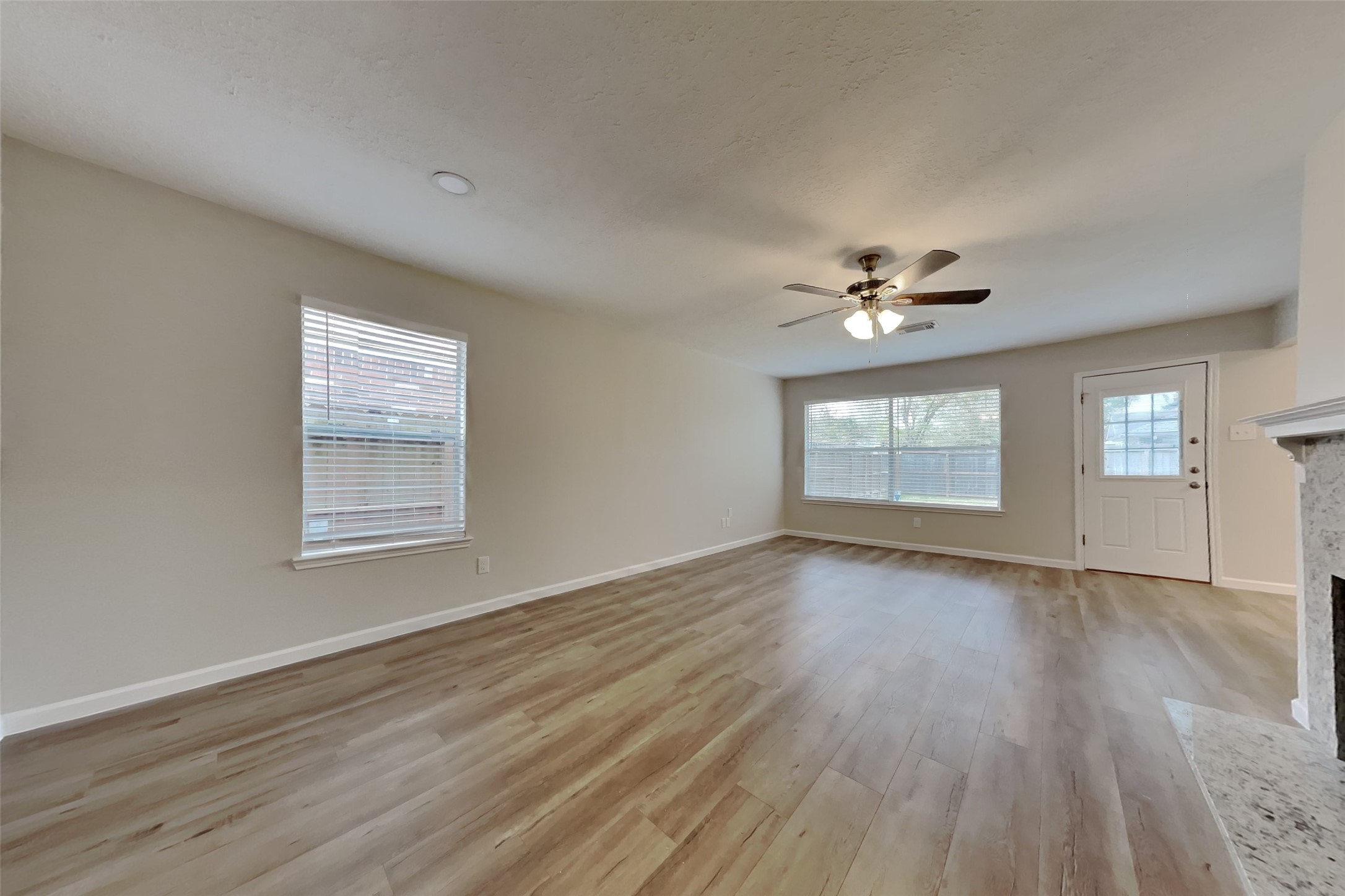30806 Melita Drive Spring, TX 77386 - Photo 2 of 18 a view of an empty room with wooden floor and a window