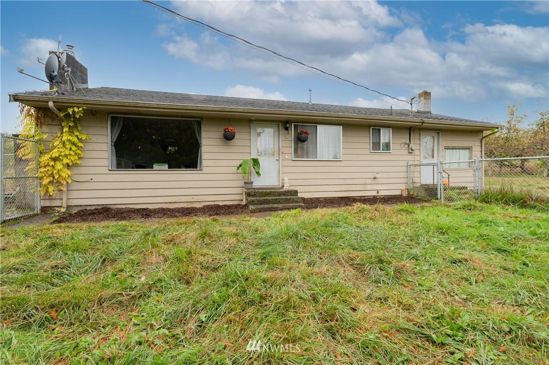 9641 Delta Line Road Blaine, WA 98230 - Photo 1 of 26 a front view of a house with garden