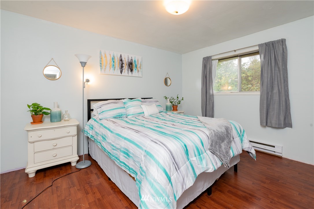 9641 Delta Line Road Blaine, WA 98230 - Photo 9 of 26 a bedroom with a bed and a window