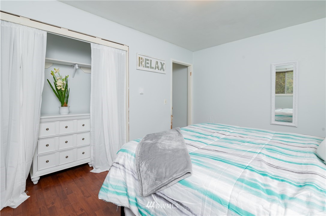 9641 Delta Line Road Blaine, WA 98230 - Photo 10 of 26 a bedroom with a bed and a dresser
