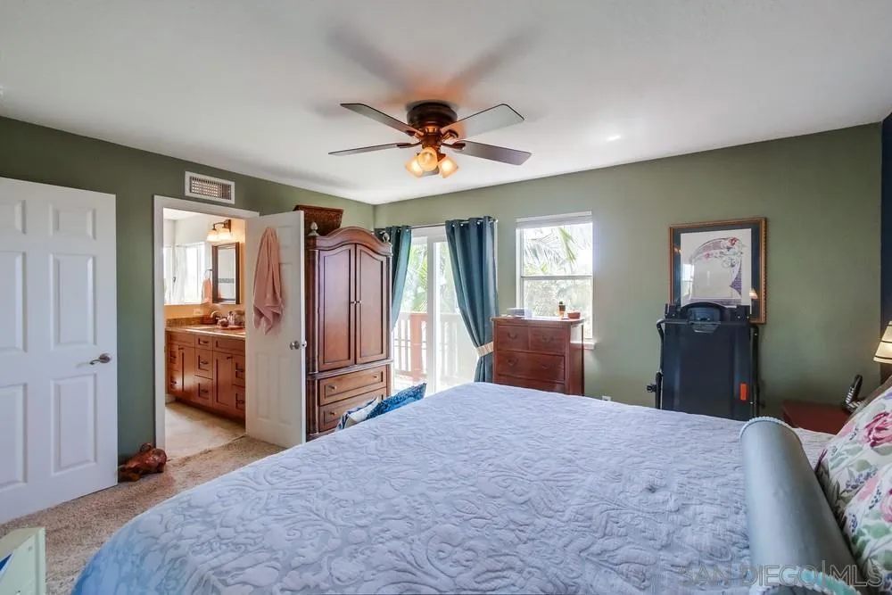 930 Gardena Road Encinitas, CA 92024 - Photo 22 of 40 a bedroom with a bed dresser and a window