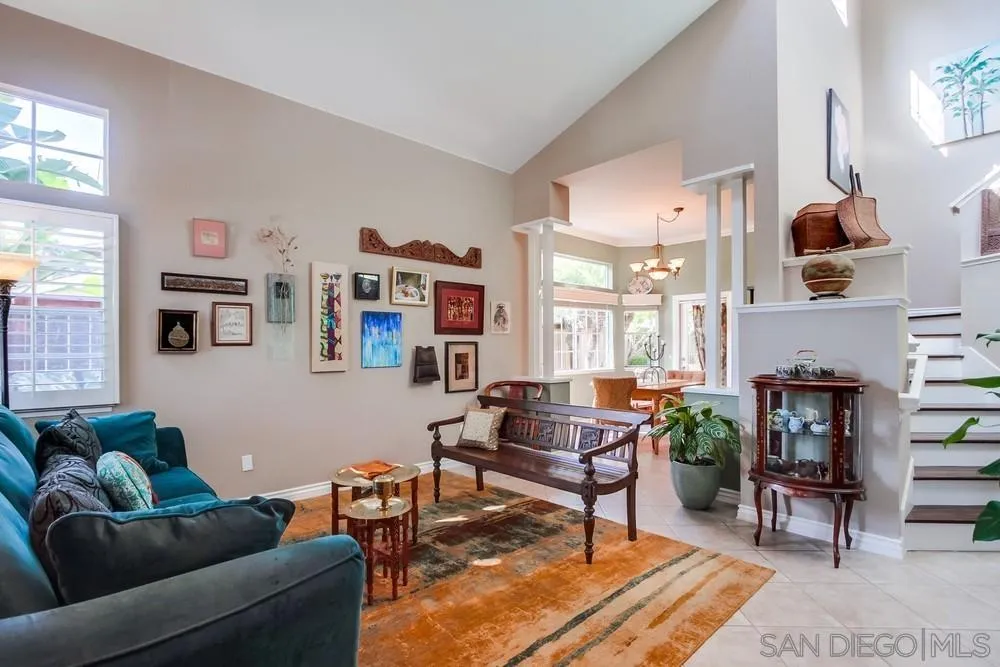 930 Gardena Road Encinitas, CA 92024 - Photo 4 of 40 a living room with furniture a fireplace and a large window