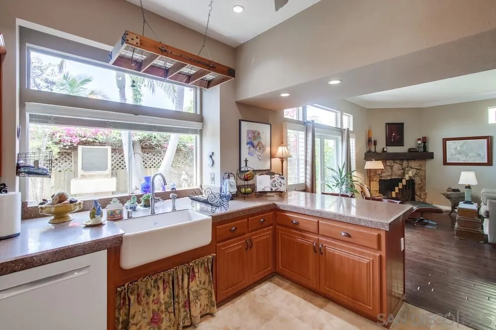 930 Gardena Road Encinitas, CA 92024 - Photo 9 of 40 a kitchen with a sink stove and cabinets
