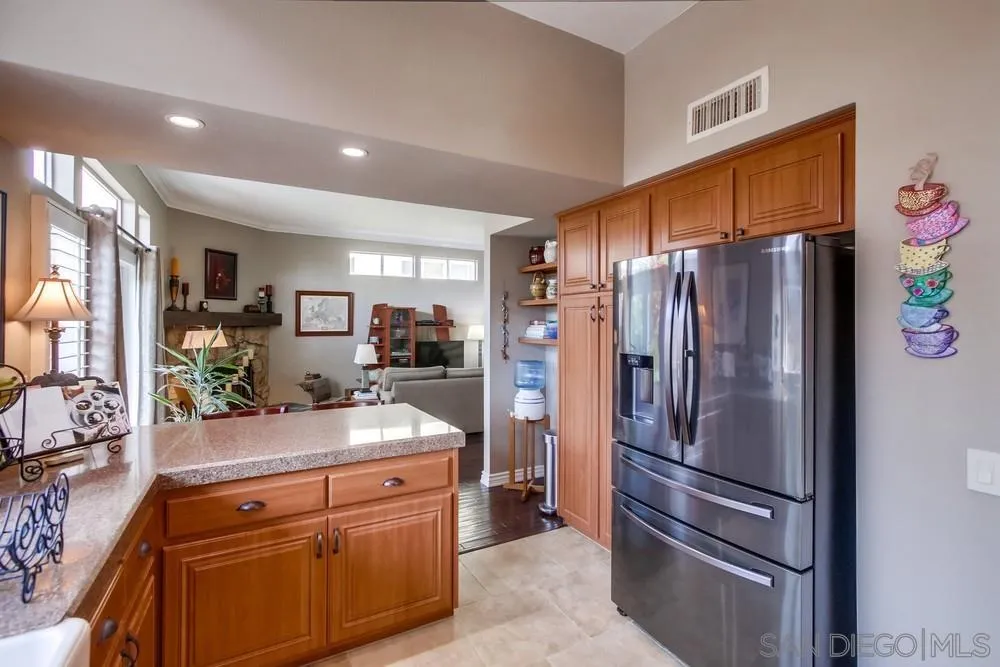 930 Gardena Road Encinitas, CA 92024 - Photo 10 of 40 a kitchen with stainless steel appliances granite countertop a refrigerator and a sink