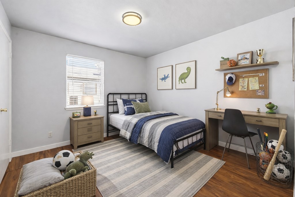 213 West Davis Street Kerrville, TX 78028 - Photo 11 of 17 a bed room with a bed and a chair