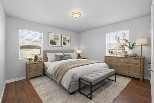 a bedroom with a bed and a window