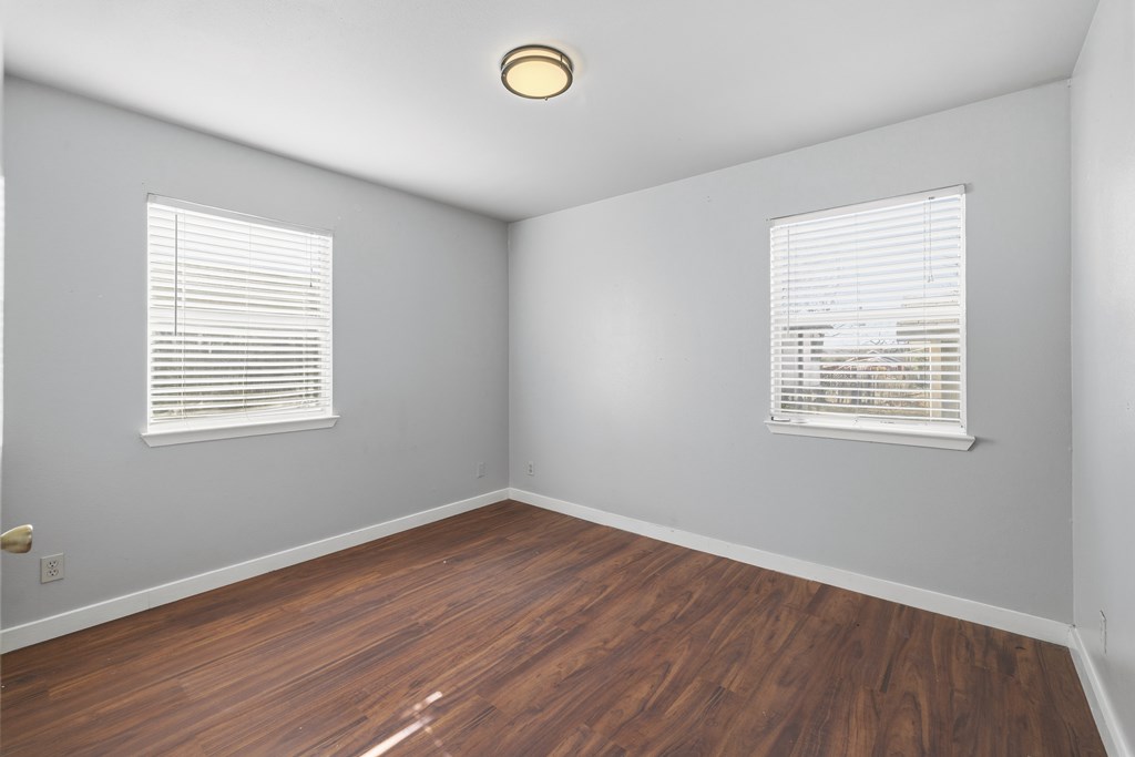 213 West Davis Street Kerrville, TX 78028 - Photo 14 of 17 a view of a room with wooden floor and windows