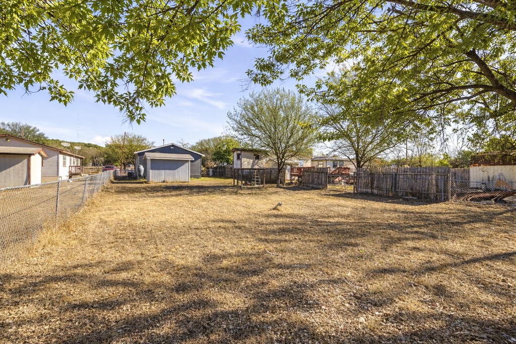 213 West Davis Street Kerrville, TX 78028 - Photo 17 of 17 a house with trees in front of it