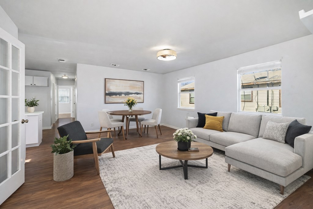 213 West Davis Street Kerrville, TX 78028 - Photo 3 of 17 a living room with furniture wooden floor and a table