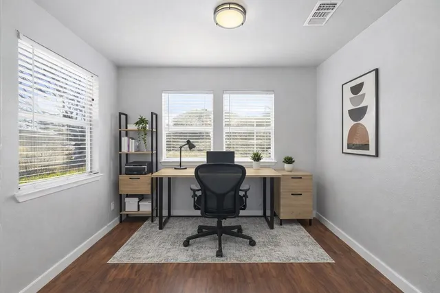 a workspace with furniture and a window