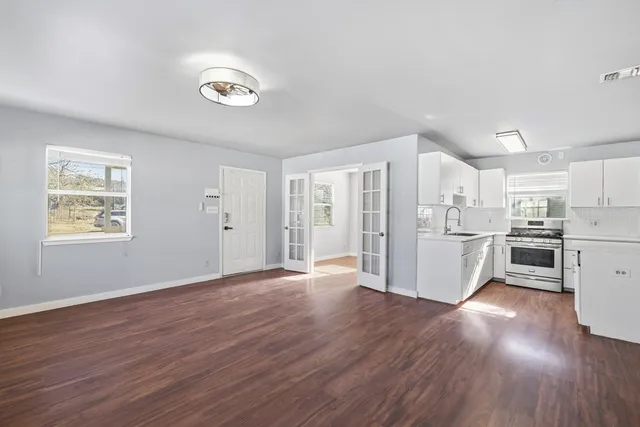 a view of a kitchen with wooden floor