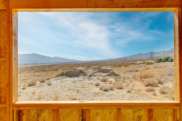 a view of multiple houses with a road