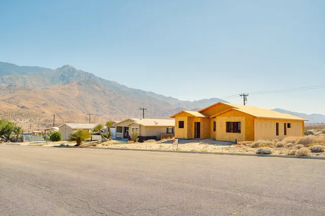 a front view of a house with a backyard
