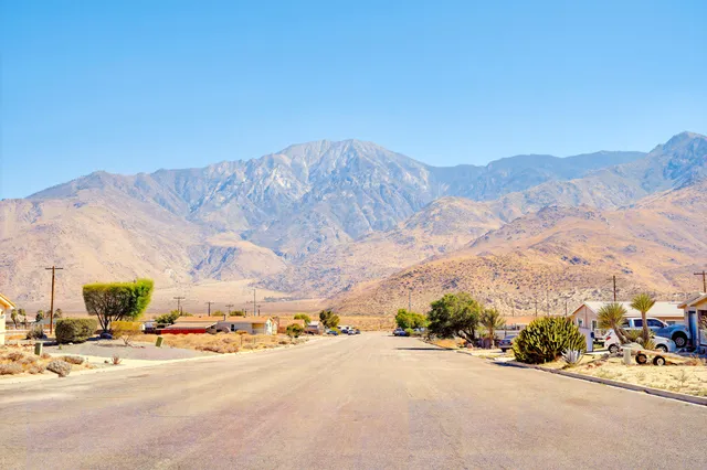 a view of a room with wooden floor and stairs