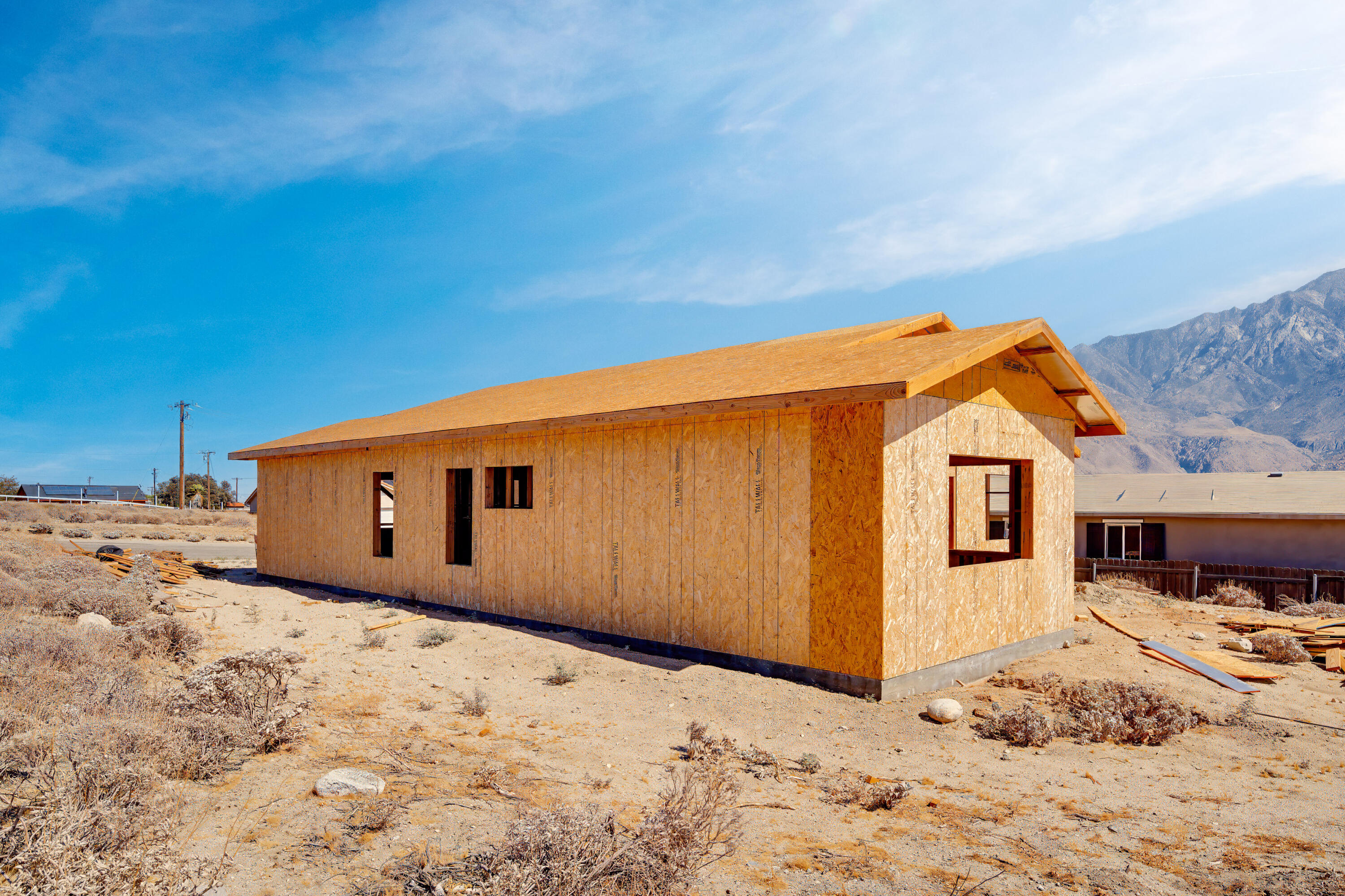 13283 Chaparral Road Whitewater, CA 92282 - Photo 5 of 28 a backyard of a house with snow on the road