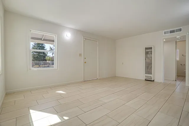 a view of an empty room and window