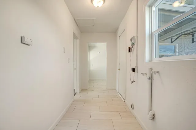 a white toilet sitting next to a white sink