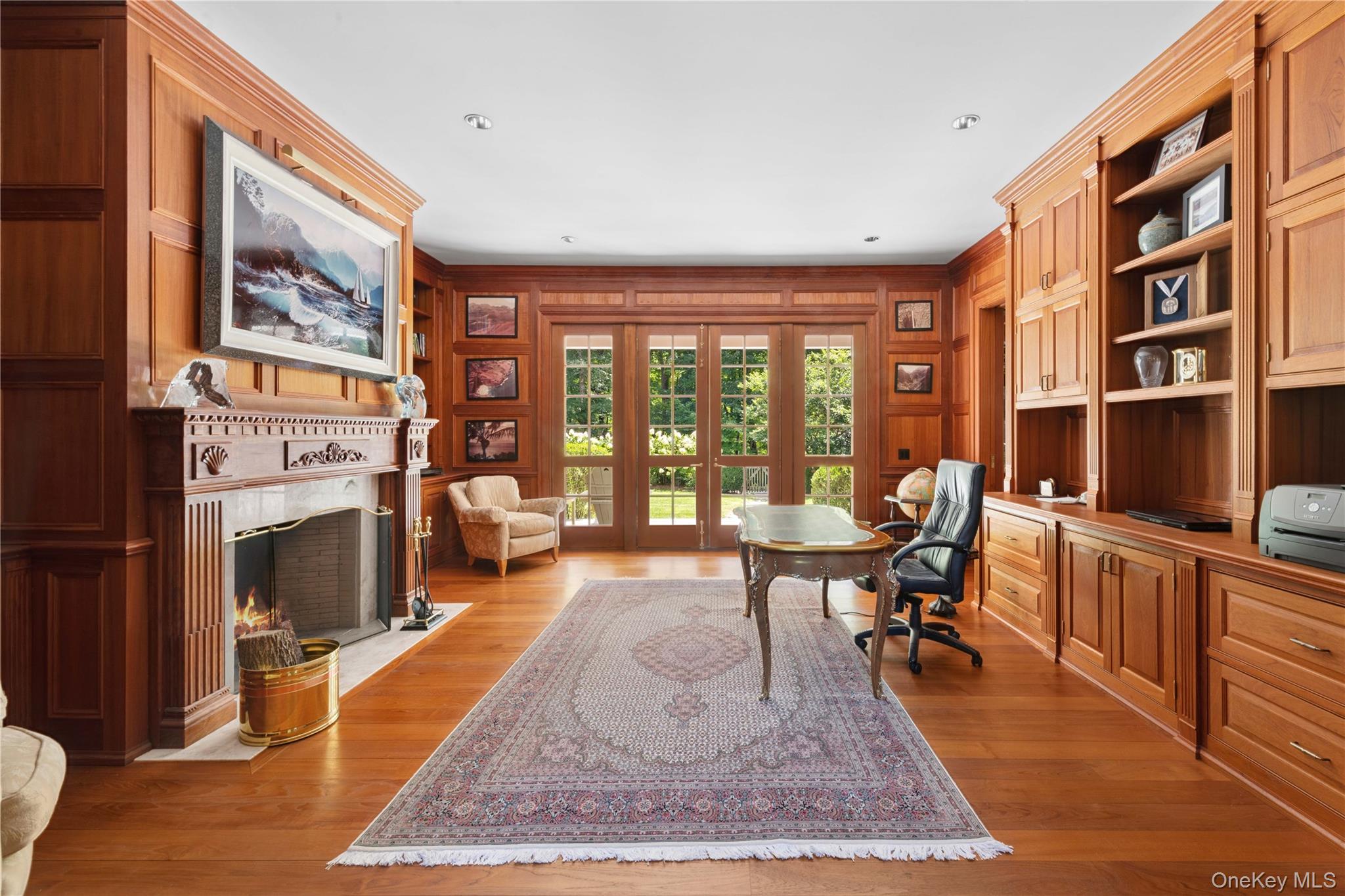 284 West Patent Road Bedford, NY 10549 - Photo 11 of 40 a living room with furniture a rug and a fireplace