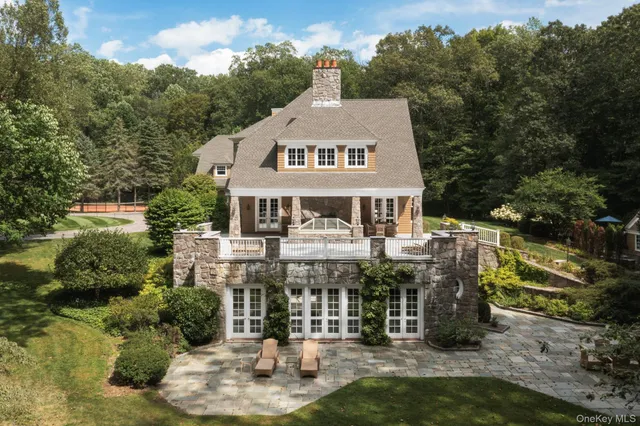 a large building with a big yard and large trees