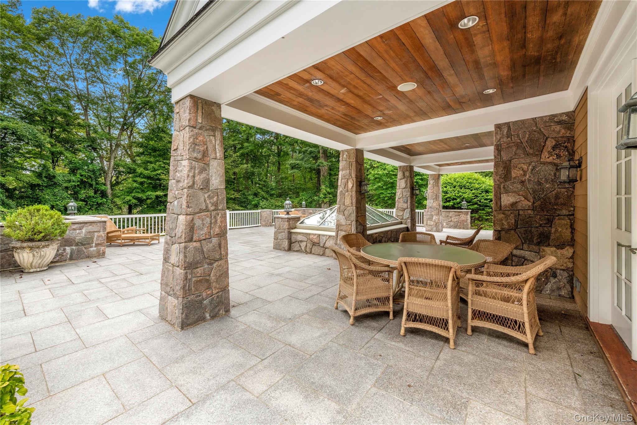 284 West Patent Road Bedford, NY 10549 - Photo 27 of 40 a patio with table and chairs