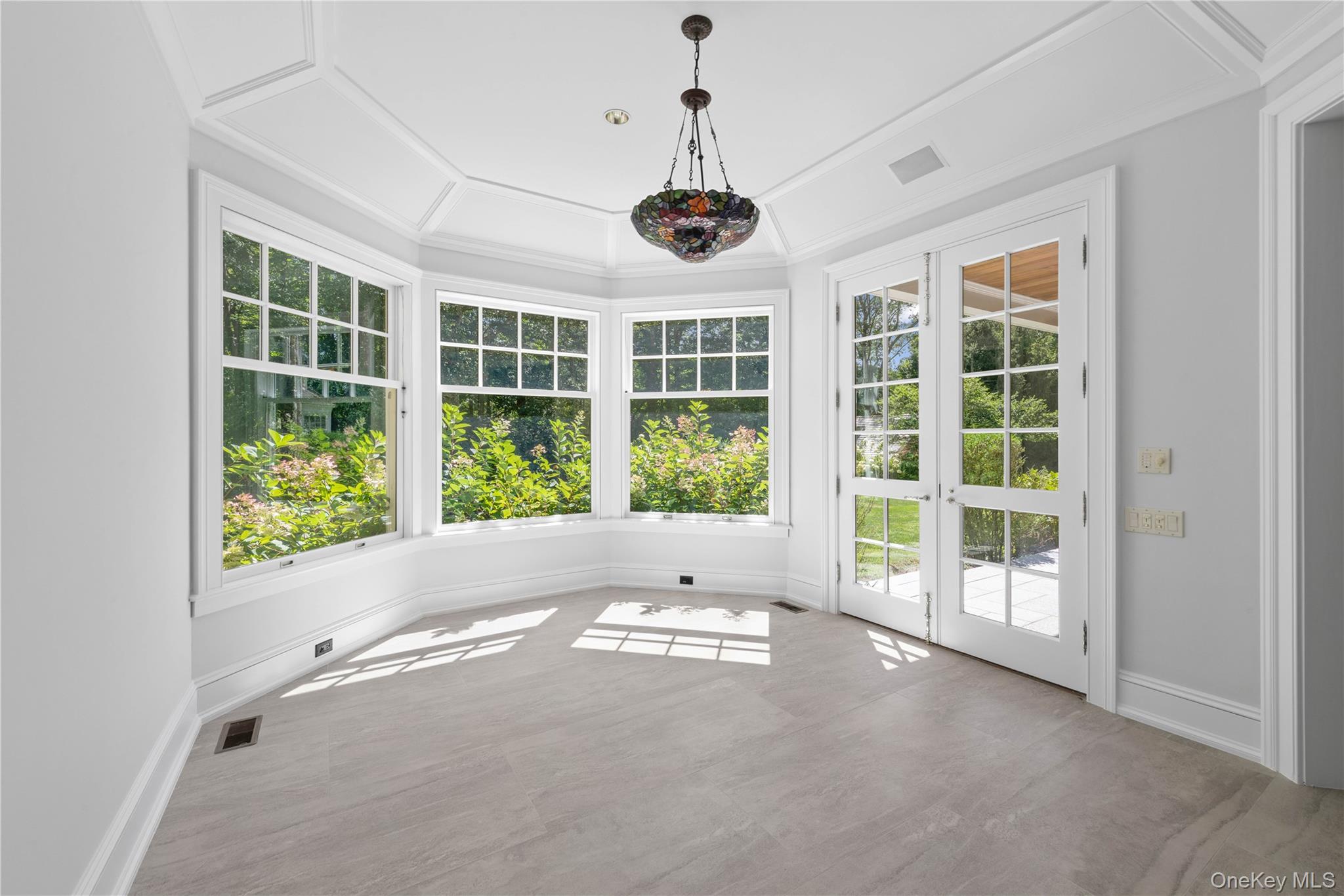 284 West Patent Road Bedford, NY 10549 - Photo 8 of 40 a view of an empty room with windows
