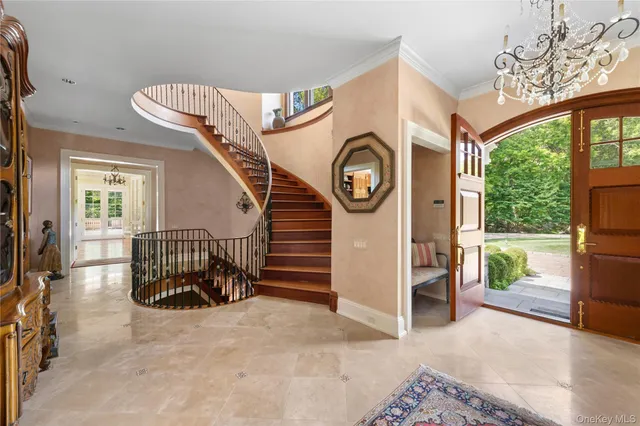 a view of a hallway with a car parked in the patio