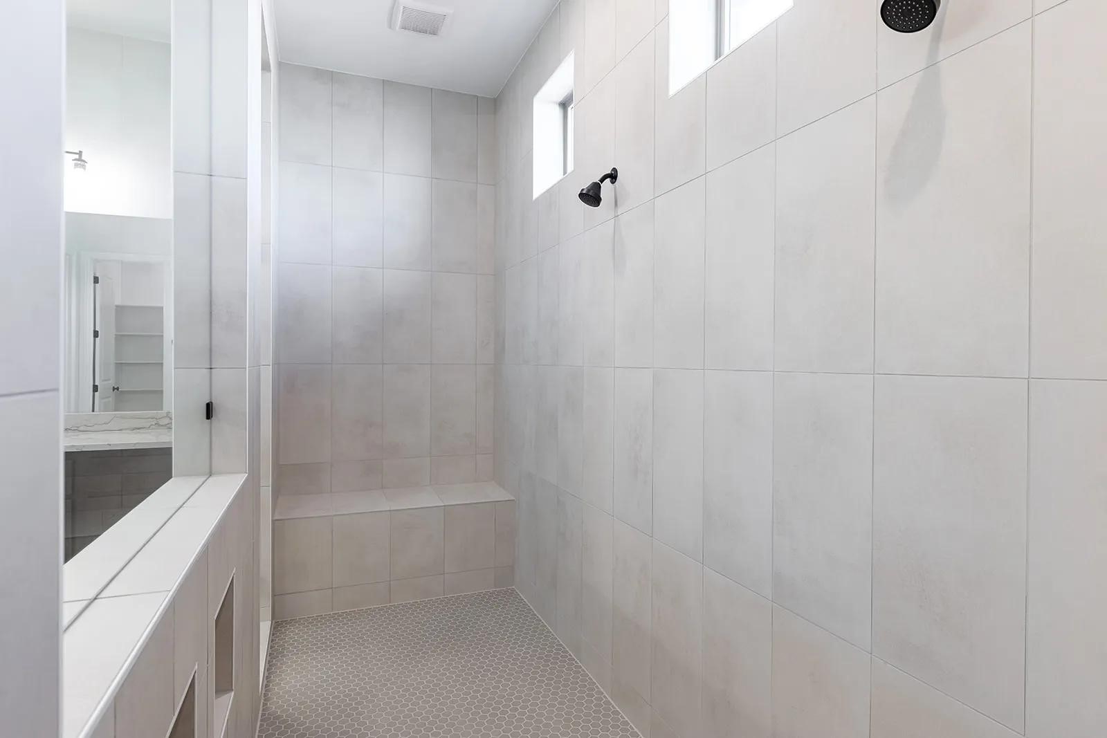 308 Buckaroo Drive Georgetown, TX 78633 - Photo 12 of 31 a bathroom with a bathtub and a shower