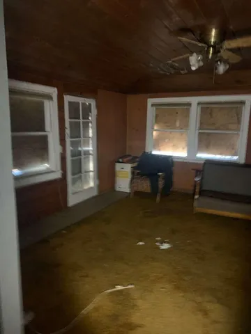 a view of an empty room with a fireplace