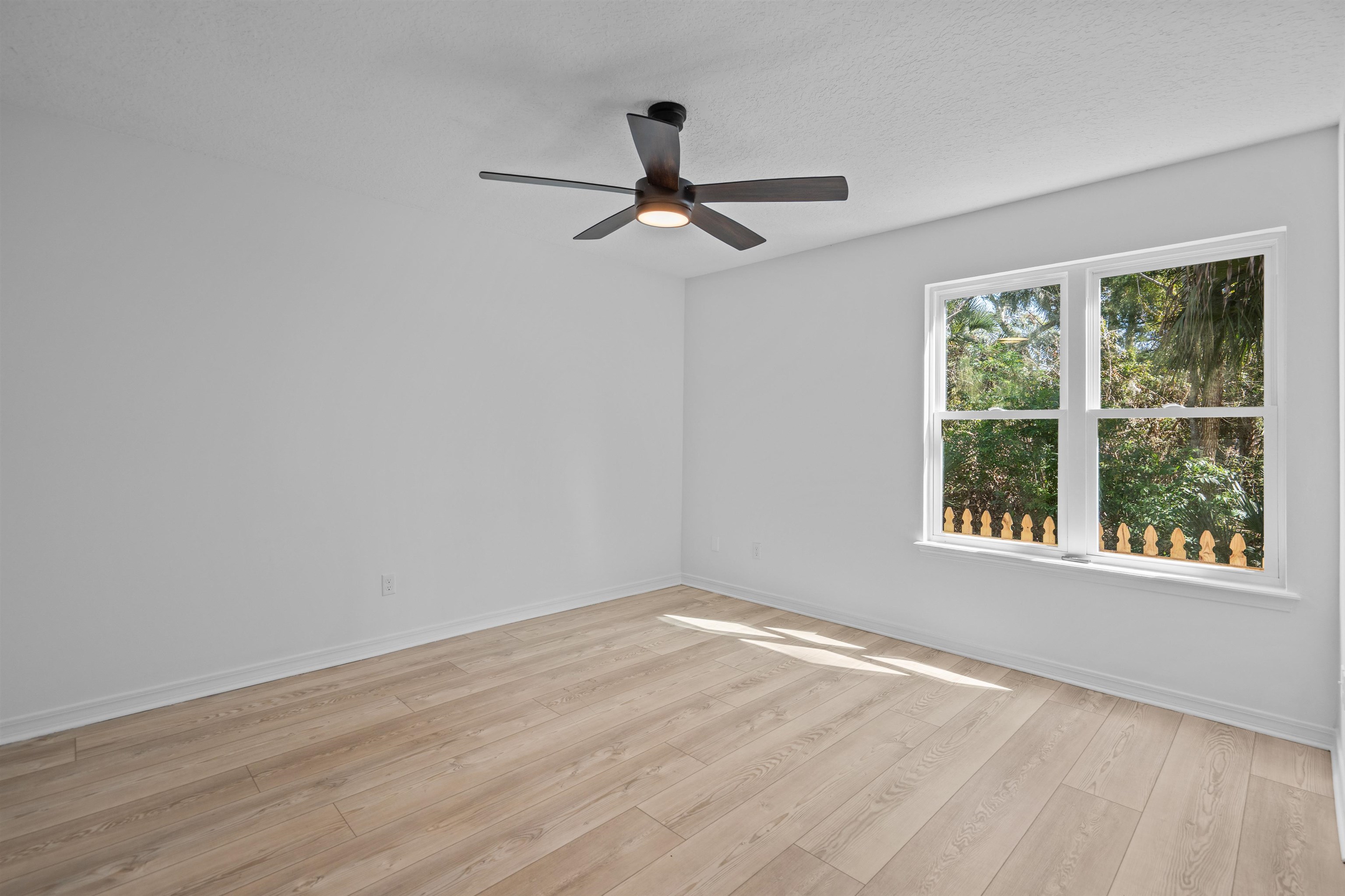 236 Nesmith Avenue St. Augustine, FL 32084 - Photo 25 of 40 a view of empty room with wooden floor and fan